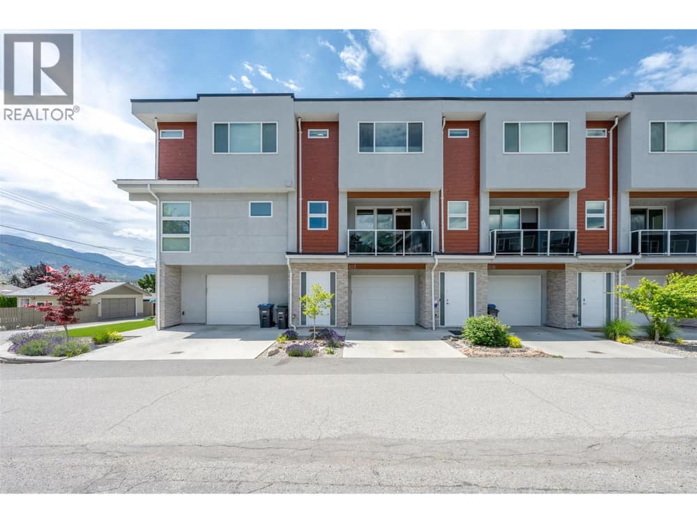 Front of home showing 1 exterior parking spot.