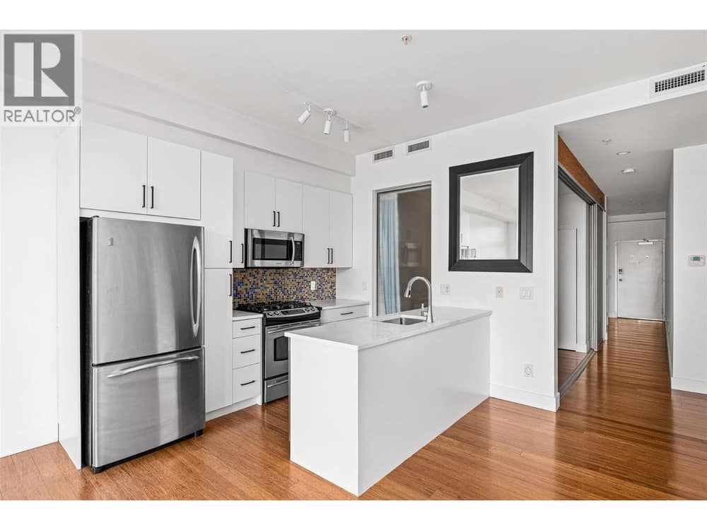 Updated kitchen with new countertops, cabinets, fixtures lighting & paint, with stainless steel appliances and a gas range!
