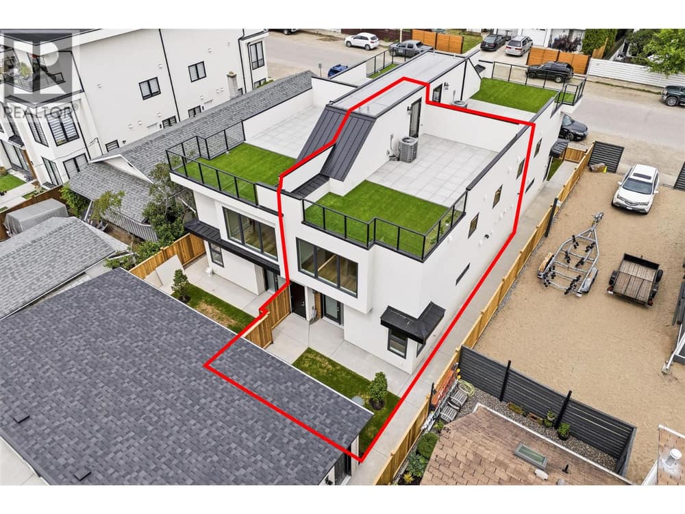 Unit #4 l Beautifully designed 3 bed/ 3 bath townhome with direct access to separate secure garage stall, private & fenced backyard space, 500+ sqft rooftop patio with stunning views and much more!