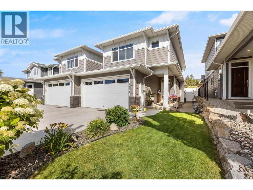Half duplex, double attached garage with 2 car driveway & beautiful landscaping