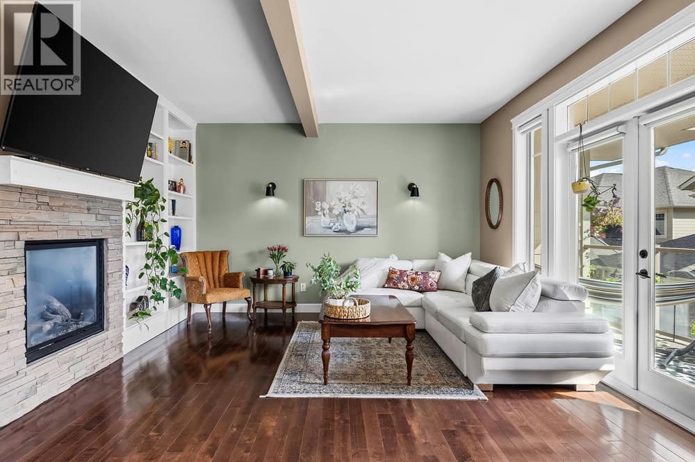 Bright and Cozy living space with built in storage and Fireplace