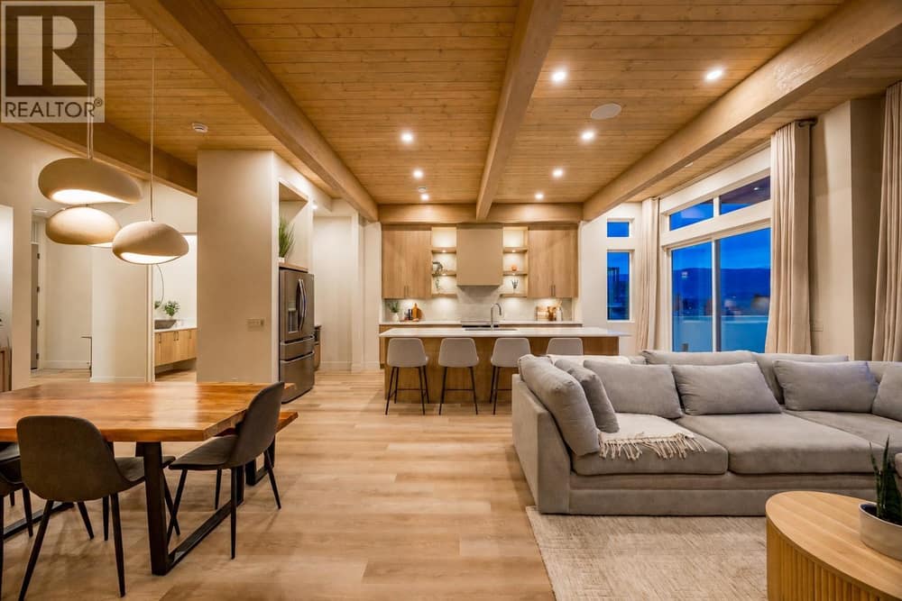 Main Living Area l Main Level - Architecturally stunning with 11 ft exposed ceilings, with oversized windows for ample natural light