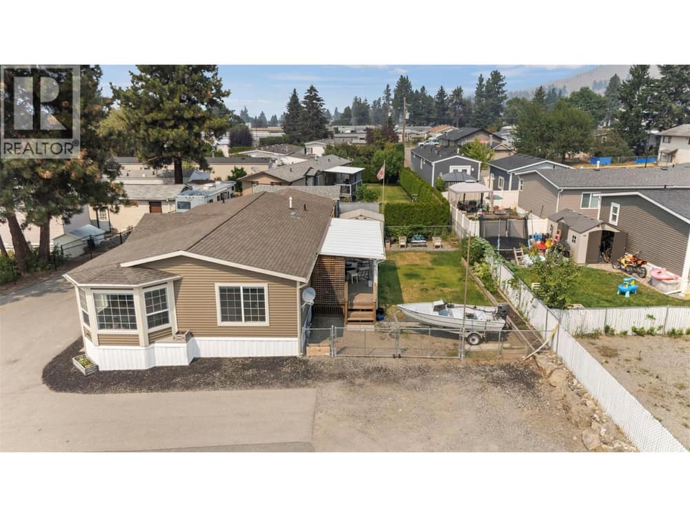 A rare amount of outdoor space for affordable living! Enjoy your own fenced yard, covered outdoor living area, garage and room for hobbies, gardening and entertaining.