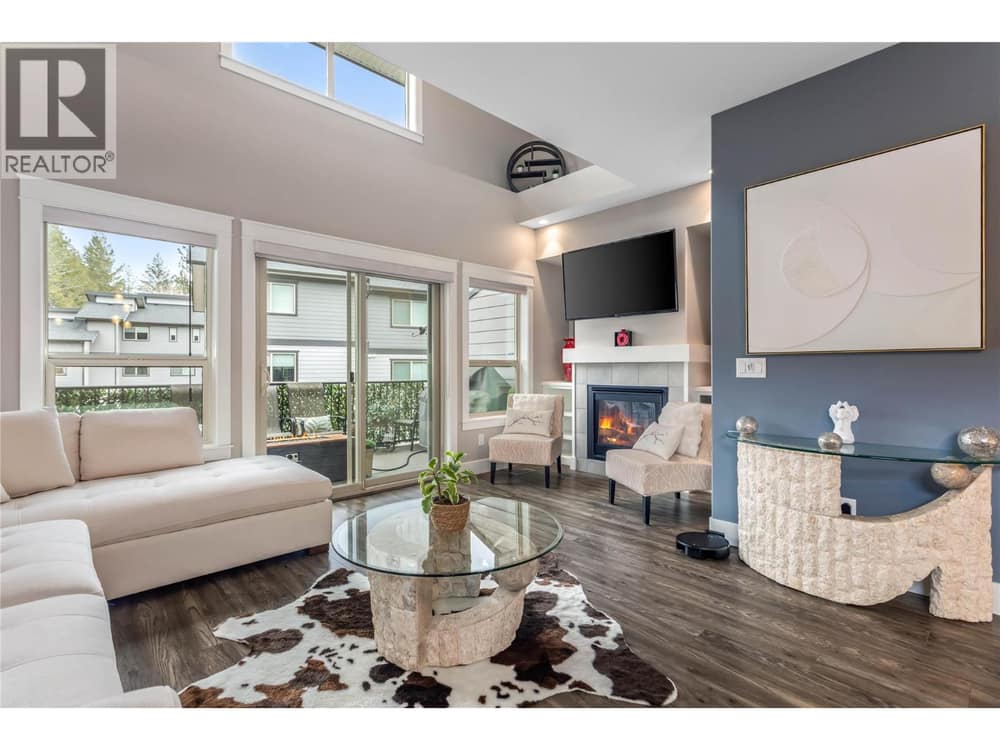 Beautiful bright open living area with 18 foot ceilings.