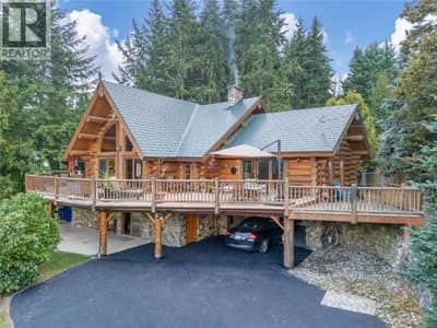 Custom build log home with double attached garage