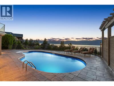 Outdoor pool in expansive fully fenced patio backyard space with stunning lake & valley views!