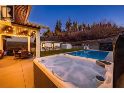 Stunning backyard space complete with 14’ x 28’ saltwater pool with cover, hot tub, gazebo, turf lawn, covered patio, storage shed, and a pool house with built-in bar and 2 piece bathroom!