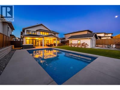 Stunning backyard space complete with 14’ x 28’ saltwater pool with cover, hot tub, gazebo, turf lawn, covered patio, storage shed, and a pool house with built-in bar and 2 piece bathroom!