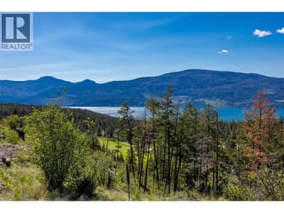 Breathtaking panoramic views of Okanagan Lake from the exceptional lot in Predator Ridge!