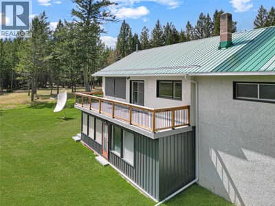 East-facing deck and sunroom on lower level.