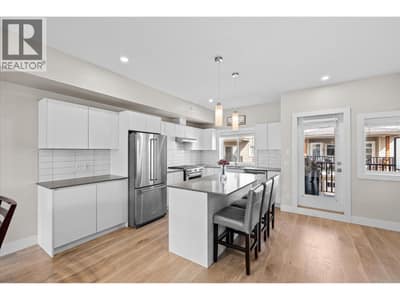 Featuring a kitchen island with room for 3 stools