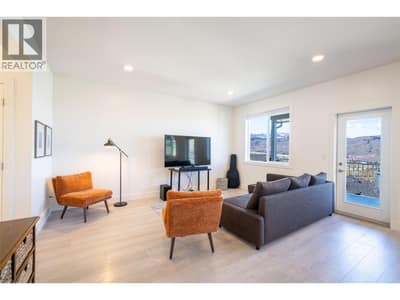 Living room with door to covered deck