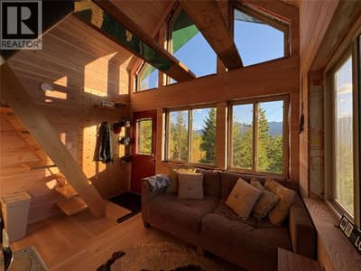 Living space with stairs to sleeping loft