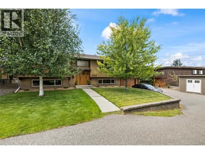 Large driveway on the right side of the home, RV parking on the left side of the home