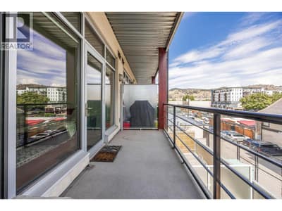 Spacious balcony with city and mountain views