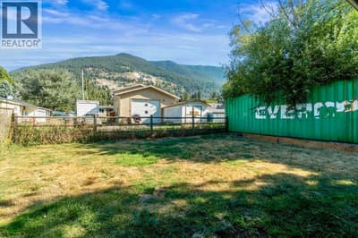 Large flat and fenced backyard with back lane way access