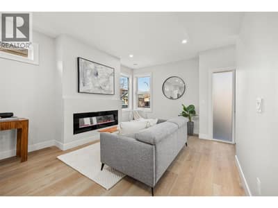 Main Level l Living room with electric fireplace