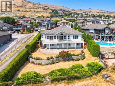 Perched on this tiered lawn, on a quiet cul-de-sac, over-looking Okanagan Lake.