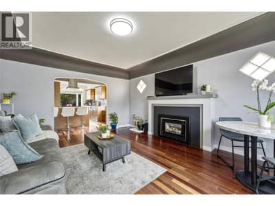Living room with hardwood floors and gas fireplace