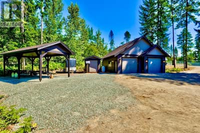 Detached heated workshop and overhead covered boat storage at Lot #4