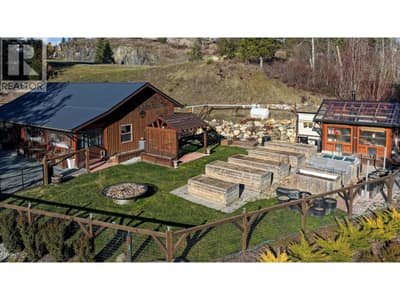 Fenced yard with raised beds Creston