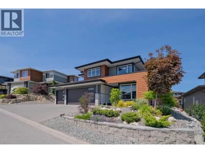 Low maintenance front yard  filled with low maintenance trees, shrubs and perennials.