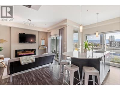 This 1 bedroom + den suite is filled with natural light, featuring large windows that showcase beautiful city and mountain views