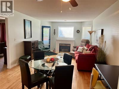 Dining/Living room has gas fireplace and door that leads to patio