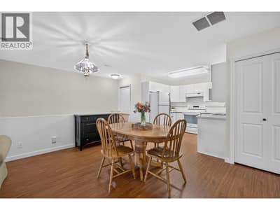 Spacious dining area flows seamlessly into the kitchen, with plenty of room to gather + entertain