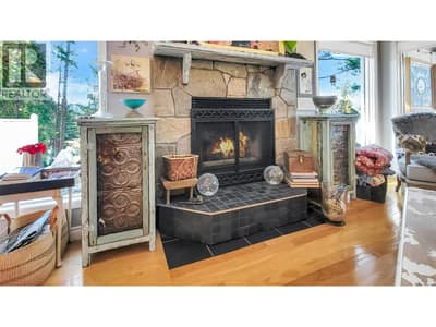 Living room fireplace has an electric insert., and is closed off at the chimney. Fire flames are virtually staged.