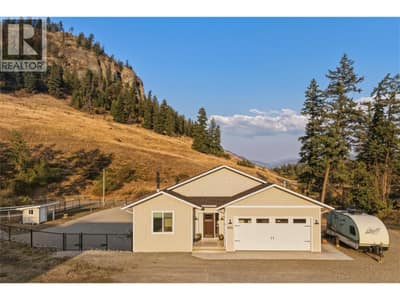 Front of home, great view of Coldstream Ranch in the background