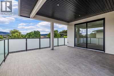 Rooftop patio off primary suite. Photo of opposite side unit