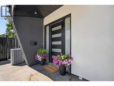 Covered private entry with hardwired security camera