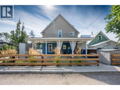 Rear of Home from 73rd Ave, offering lovely garden space and carport