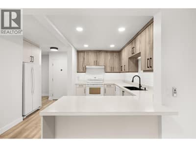 Fully updated throughout with new flooring, paint. Updated cabinetry.
