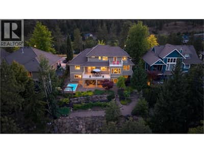 Stunning backyard retreat with multiple outdoor living spaces, lush landscaping, fruit bushes and private plunge pool.