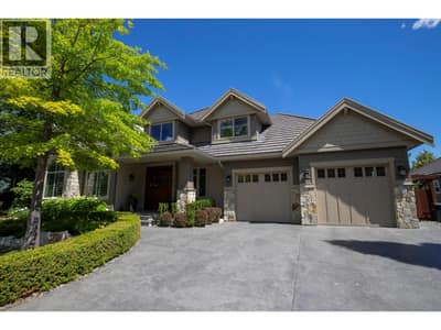 Stunning curb appeal with stamped concrete driveway, beautiful stonework and a durable concrete tile roof.