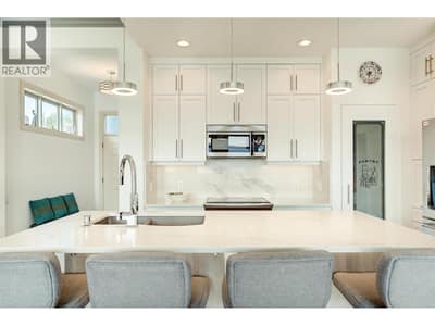 Beautifully updated kitchen with soft closed cabinets, quartz counters and stainless steel appliances