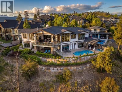 Commanding luxury estate at 162 Skyland Drive in Wilden. This spectacular 5,457 sqft rancher walkout sits on a private 0.84-acre lot designed to maximize panoramic Okanagan lake and valley views.