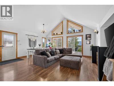 A-frame style home with various doors to access outside