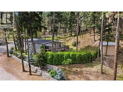 Relax on the expansive deck while enjoying the privacy and serenity of this park-like setting.