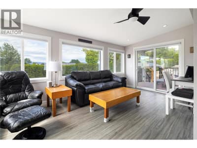 large open entry sitting area in the sun porch, lots of windows!