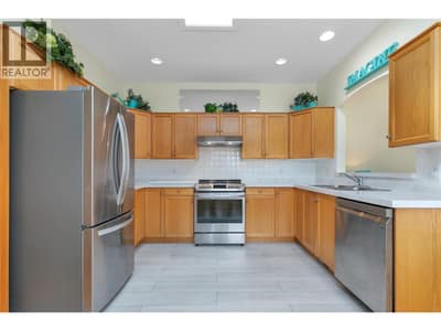 Updated appliances,  solid surface counters, Sky light.  Bright and spacious with open views to living and den.