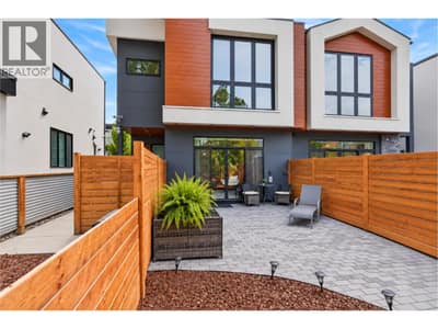 Gorgeous curb appeal with warm wood accents.