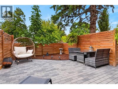 Private, fully fenced patio with mature landscaping and plenty of space to relax or entertain.