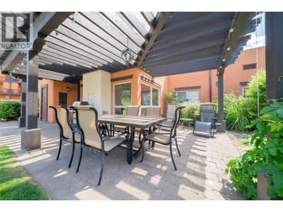 Al Fresco Dining on your Patio, just steps from the Beach, Pool, Hot Tub and Gym