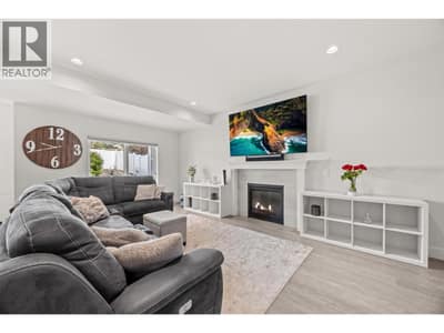 Bright and spacious living room w/gas fireplace.