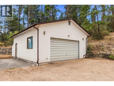 Large garage/shop with 220 outlet for EV charger.