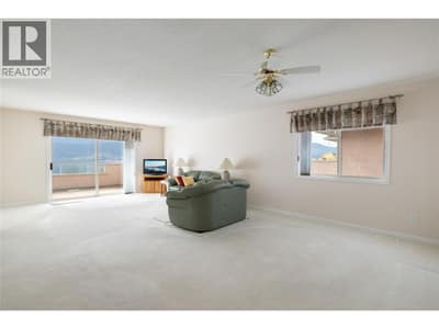 Main floor living room and dining area. Great natural light