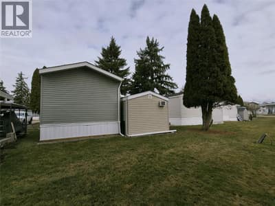 Rear view of home and shed